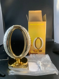 Detail of modern star moon night light with gold base, crystal texture, and USB cable