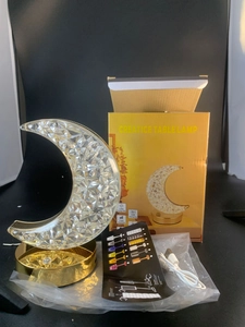 Moon crystal lamp detail with gold base, USB cable, and packaging for bedside lighting
