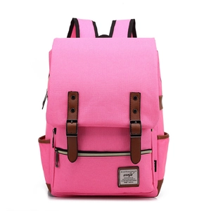 Pink canvas backpack with brown leather buckle straps and flap cover design