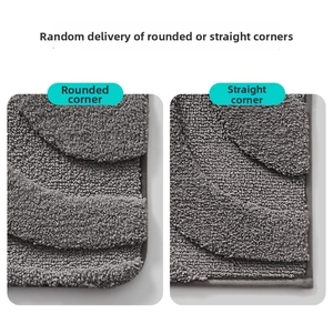 Detailed comparison of rounded and square corners on a gray textured absorbent bath mat