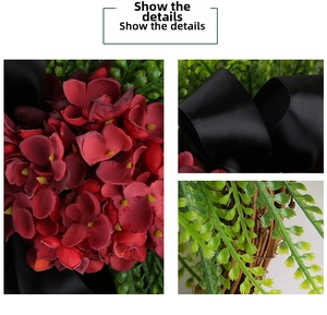 Close-up of red hydrangea petals, green fern leaves, and black satin ribbon detail