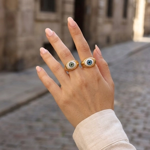 Fashionable gold evil eye resin rings with realistic blue and green iris textures