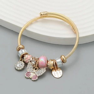Golden spiral beaded bracelet with pink butterfly charms and crystal beads