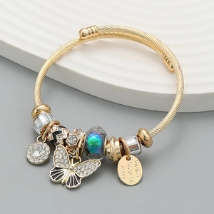Gold beaded wrap bracelet featuring sparkling butterfly charms and colorful glass beads
