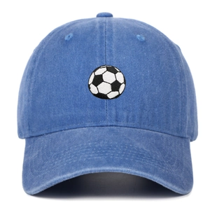 Detail of embroidered soccer pattern on blue washed cotton baseball sport cap