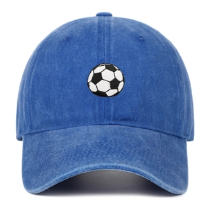 Close-up of classic black and white football embroidery on washed navy denim baseball cap