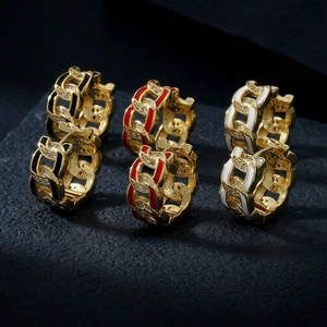 Macro shot of Cuban chain hoop earrings with colorful enamel and cubic zirconia inlays