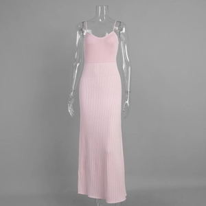 Detail of pink knitted camisole dress showing the ribbed texture and fishtail hemline