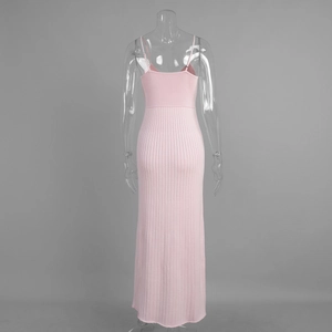 Detail view of pink ribbed knit texture and slim-fit fishtail hem on back of long dress