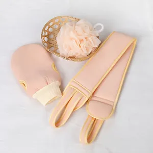 3-piece pink exfoliating bath set with body scrubber, shower ball and mitt on white cloth