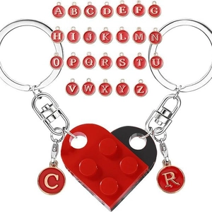 Detail of interlocking heart block keychains with A-Z alphabet charms for couples
