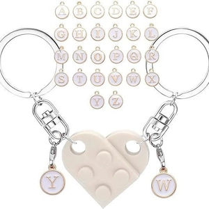 Detail of heart-shaped brick keychain with customizable letter charms from A to Z