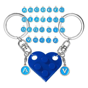 Detail of heart-shaped block keychain set with 26 blue enamel alphabet charms on white