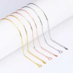 Detail of S925 sterling silver chain with spring clasp and engraved logo tag in three colors