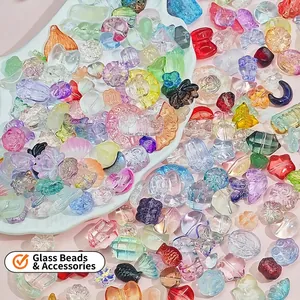 Mix of colorful glazed glass DIY jewelry charms in heart and flower shapes for necklaces