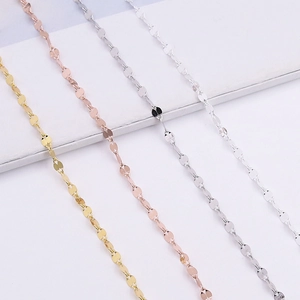 Macro detail of four assorted S925 sterling silver chain finishes in a sequin scale design