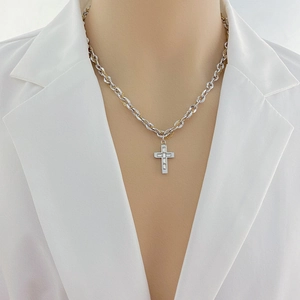 Titanium steel cross necklace with rectangular zircon pendant worn on white suit