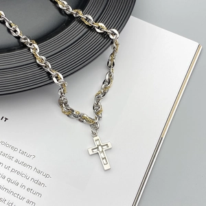 Two-tone mixed chain cross pendant necklace with clear cubic zirconia inlays