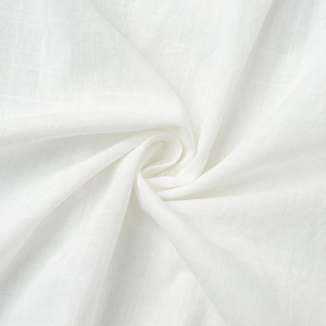 Macro shot of white woven cotton fabric showing clear texture and breathable fibers