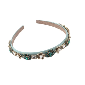 Elegant baroque headband with pearls and green rhinestones on a light blue leather band