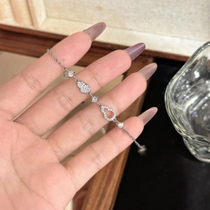 Elegant silver Wu Lou bracelet for women with pavé-set sparkling cubic zirconia charms
