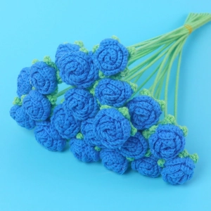 Handmade knitted bouquet with deep blue crochet roses and green stems for gift decor