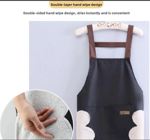 Detail of waterproof apron featuring side coral fleece hand towels and a large front pocket