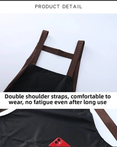 Detail of waterproof apron featuring adjustable wide brown shoulder straps and a deep front pocket