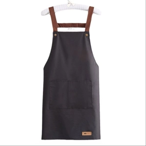 Waterproof dark grey kitchen apron with brown straps and dual front storage pockets