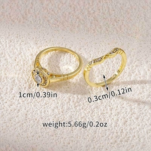 Detailed view of gold plated engagement ring set with cubic zirconia on stone background