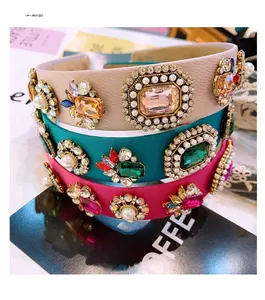 Detailed close-up of Baroque wide headbands with colorful crystals and pearls