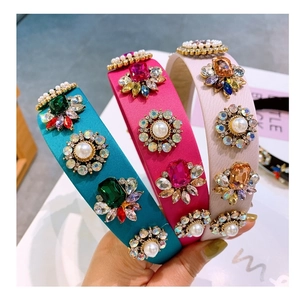 Detailed close-up of Baroque style wide headbands with crystals, pearls and sequins