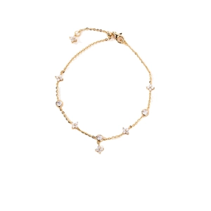 Elegant gold four-leaf flower bracelet with sparkling cubic zirconia and adjustable chain