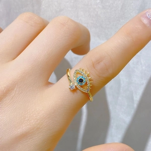 Adjustable golden evil eye open ring for women with blue crystals and eyelashes