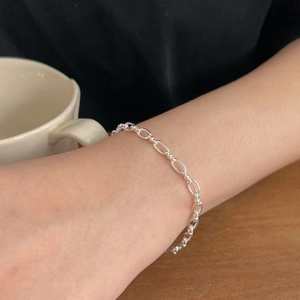 Minimalist S925 sterling silver geometric link chain bracelet on a female wrist