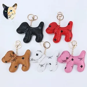 Set of luxury dog shaped leather keychains in five colors with classic floral patterns