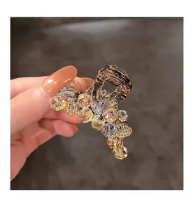 Macro detail of luxury crystal hair claw clip with colorful macaron tone faceted beads