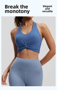 Detailed view of blue halter neck sports bra with unique front twist knot design