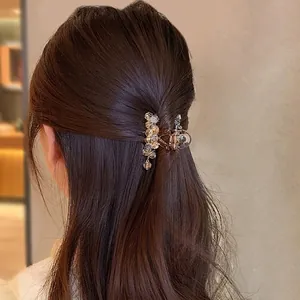 Elegant amber crystal hair claw clip shown on a woman's half-tied hair for a luxury look