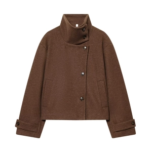 Detail of dark brown wool coat with stand-up collar and asymmetric buttons on white background