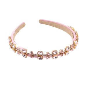 Baroque pink fabric headband embellished with pearls and rhinestones on a white base