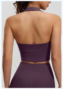 Rear view of deep purple halter neck sports bra with cross back and high waist yoga leggings