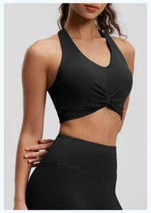 Black high-elastic sports bra with front twist knot detail and matching yoga leggings