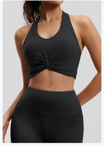 Detailed front view of high-stretch halter sports bra with knot detail and yoga leggings