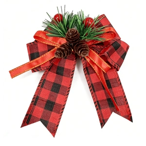 Detail of Buffalo Plaid Christmas bow with pine needles, red berries, and pine cones