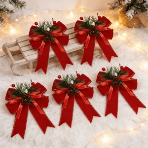 5pcs Christmas red velvet bows with pine needles, red berries and gold trim on white rug