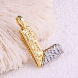 Macro shot of two-tone hammered gold and silver letter L pendant with micro-set zircon