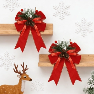 Red velvet Christmas bows with pine needles and cones for tree decoration