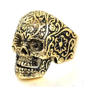 Vintage gothic skull ring with ruby inlay and intricate floral sugar skull engraving
