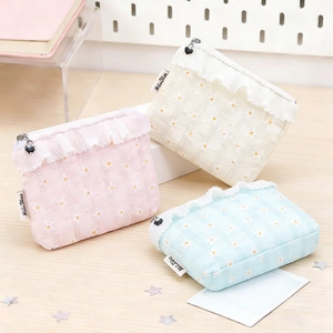 Floral daisy pouch with ruffle trim and heart zipper in pink, white, and blue colors
